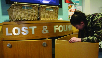 Eighth grader Marissa Skor looks for her clothing in the Lost and Found.