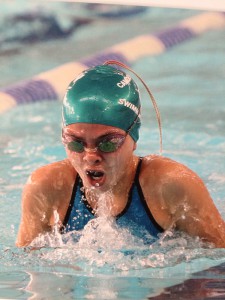 Eighth grader Anna Podurgiel, comes up for a breath in her 200 meter breast stroke race. This competition was at Middlesex county last fall (photo courtesy of Anna Podurgiel ). 