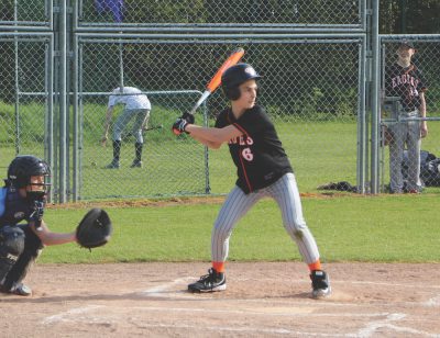 Eighth-grader Gabe Hajjar prepares to hit the ball in return to a TASIS pitch. Hajjar made it to second base and they concluded to win the game 6-2 on May 5. (photo courtesy of Ms. West)